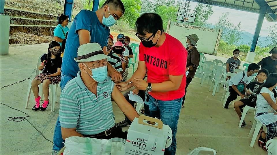 Health workers administer Covid-19 vaccine for residents in the remote village of Acoje in Santa Cruz, Zambales